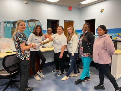 Pm Pediatric Care staff in the office doing a medical training exercise